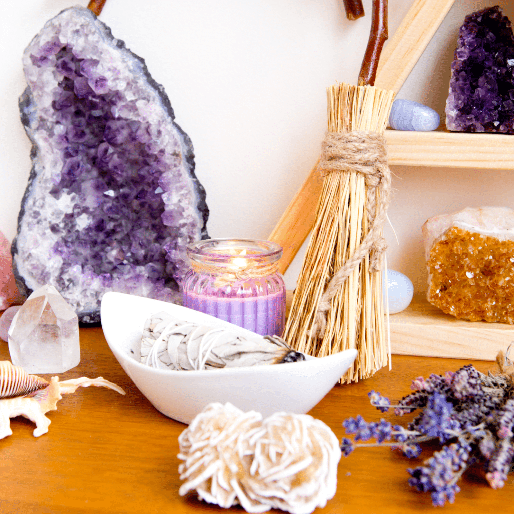 Altar Space or Sacred Space with crystals including selenite, amethyst and purple candle.